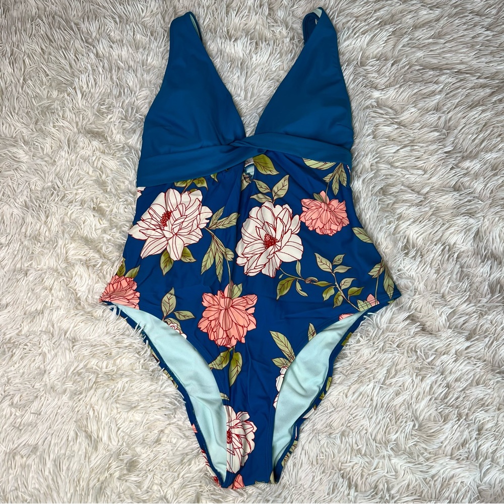 One piece dark teal bathing suit.